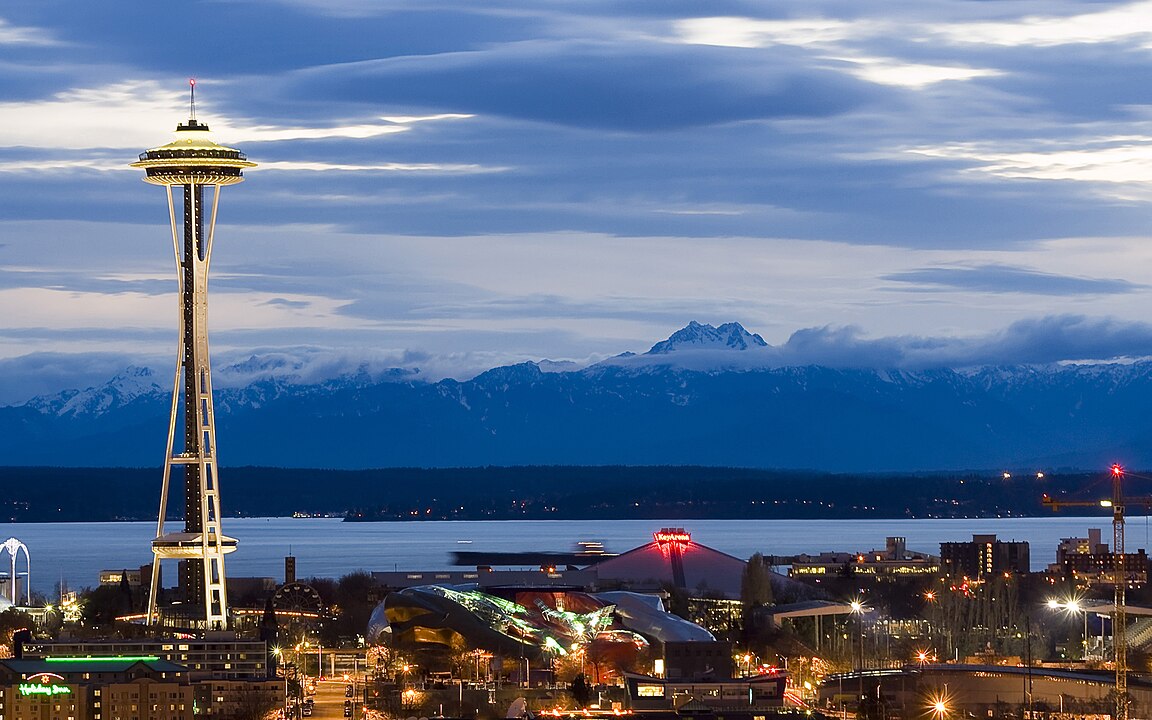 Rainy Seattle skyline with contrasting dry Eastern Washington landscape
